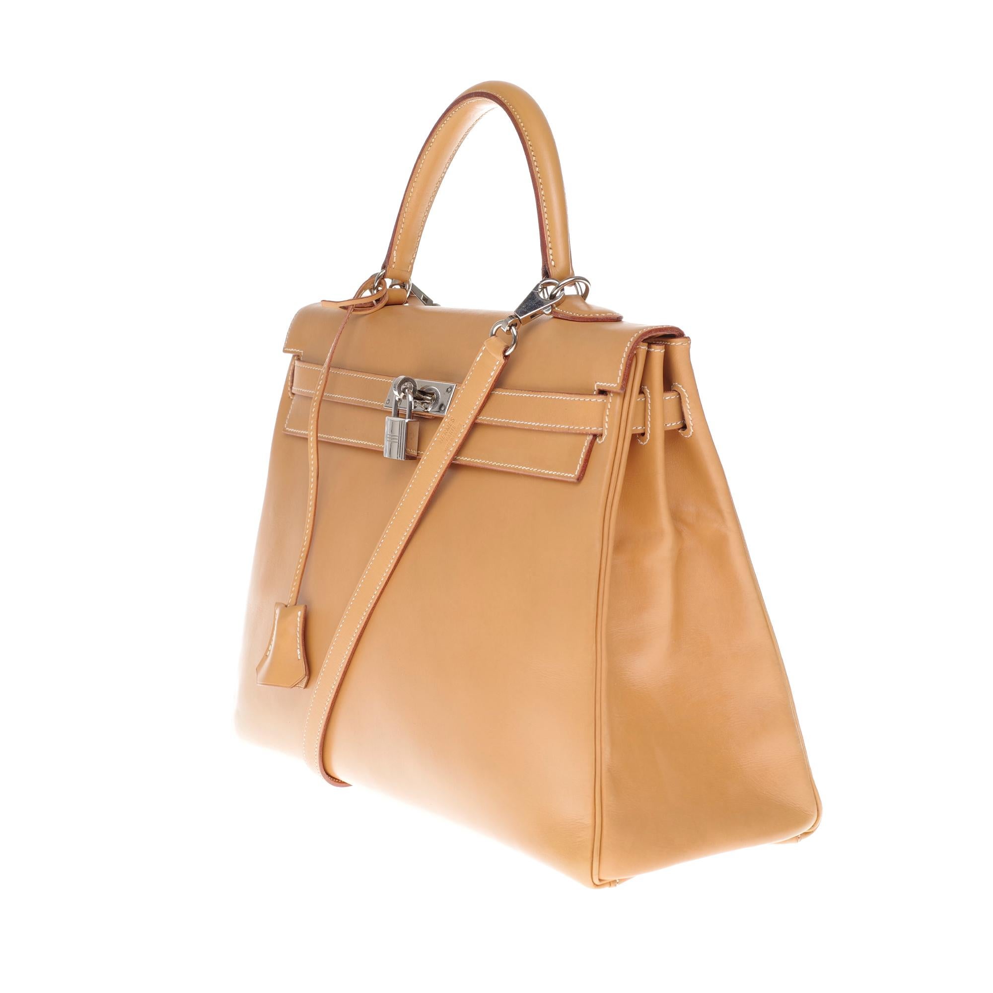 Orange Hermès Kelly 35 handbag in natural calf leather with strap and silver hardware