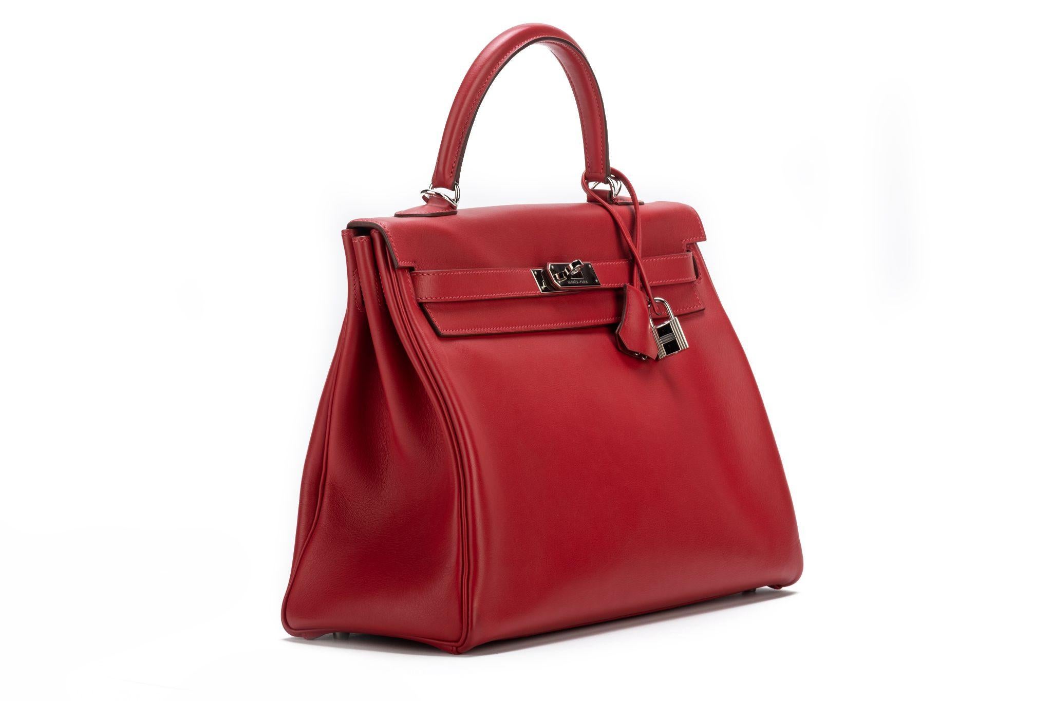 Hermes kelly 35cm retourne rouge casaque swift leather and palladium hardware in excellent condition. Handle drop 3.5