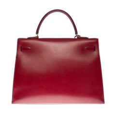Hermès Kelly 35 sellier strap shoulder bag in burgundy calf leather, GHW