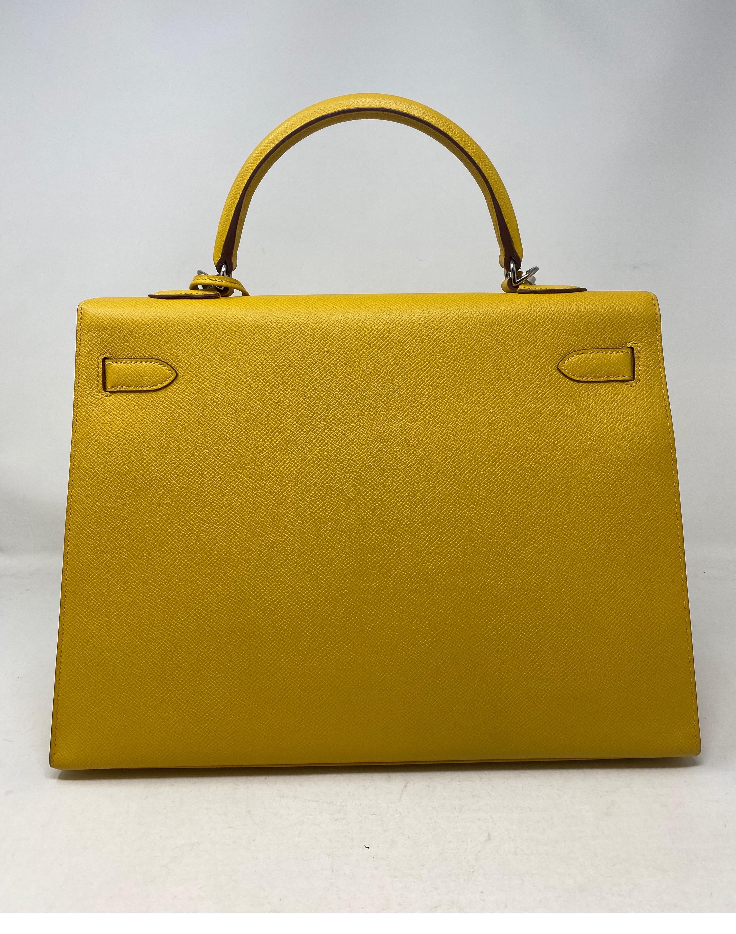 Hermès Kelly 35 Soleil Bag. Color is yellow like the sun. Veau Epsom leather and Palladium plated hardware.  Like new condition, comes with authentication from Bababebi. Sellier bag. Includes clochette, lock, keys, and dust cover. Guaranteed