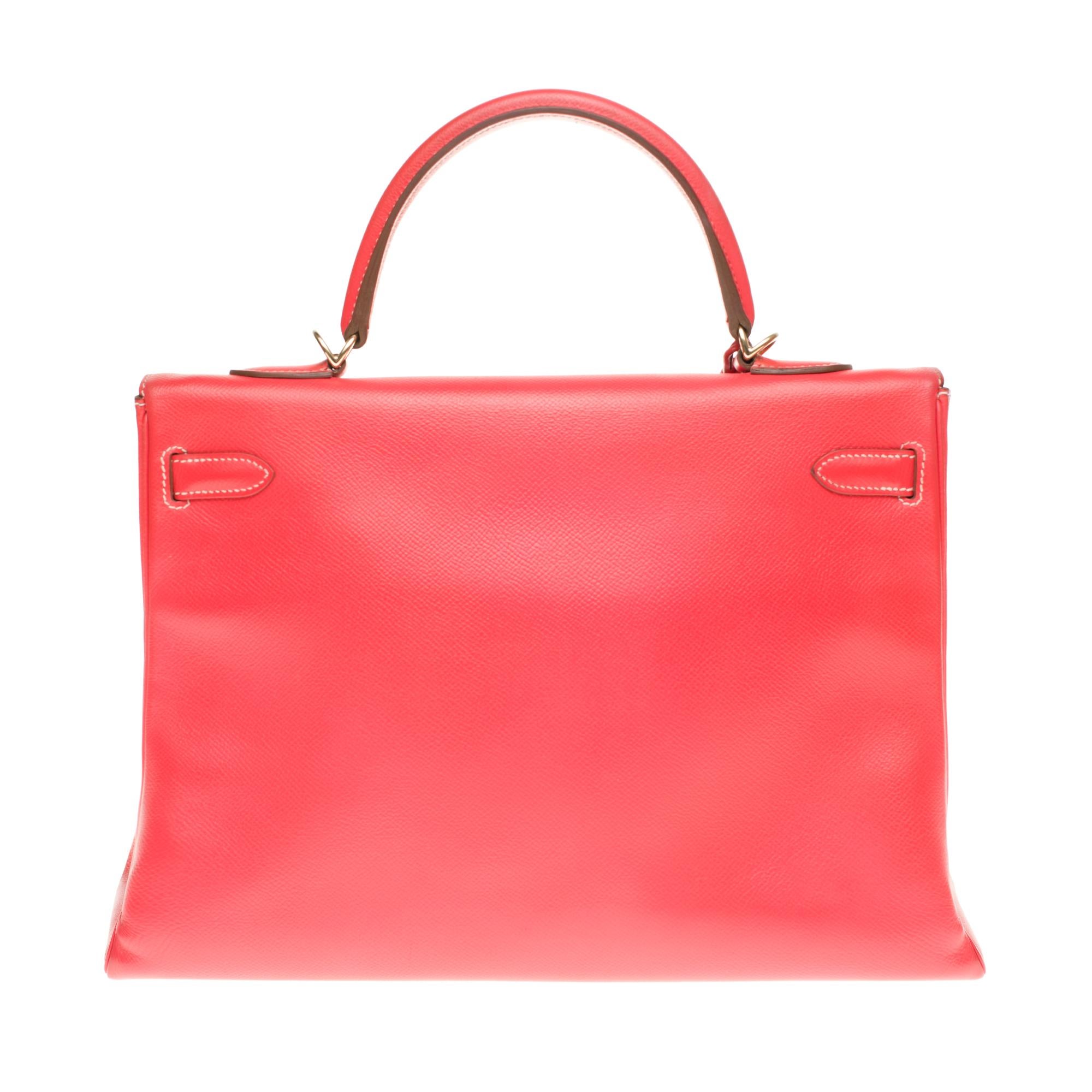 A limited-edition Hermès Kelly 35 Candy Collection made from Epsom leather featured in Rose Jaipur and Gold with visible signs of wear. Rose Jaipur is the name of the Indian city of Jaipur, also known as the “Pink City”,  where all buildings are