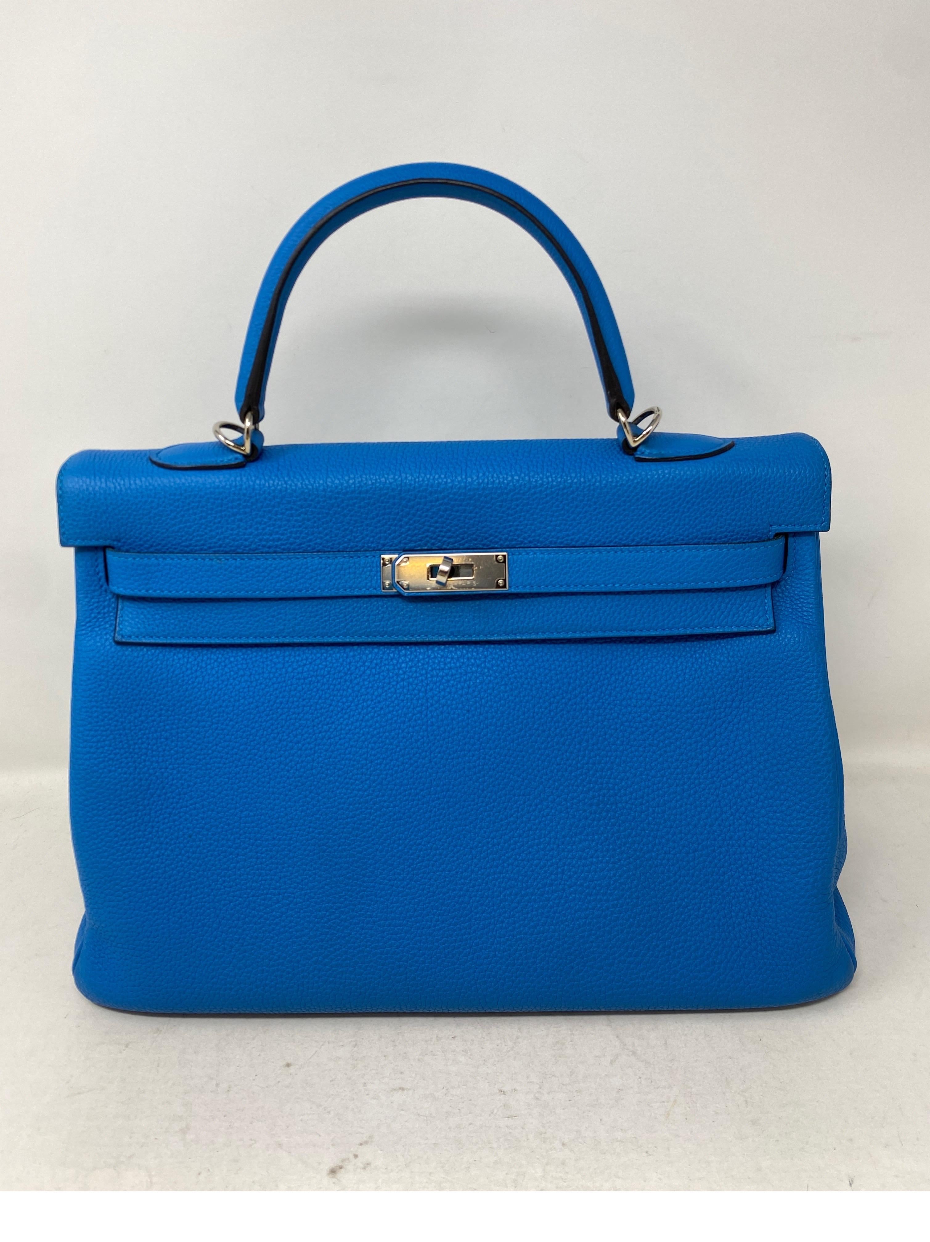 Hermes Kelly Zanzibar 35 Bag. Excellent condition. Vibrant blue color. Silver palladium hardware. Looks like new condition. Never used. Includes clochette, lock, keys, and dust bag. Guaranteed authentic. 
