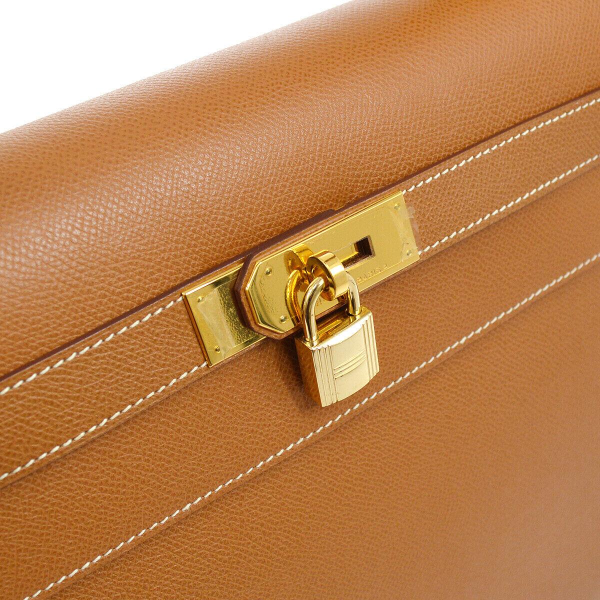 Hermes Kelly 40 Cognac Togo Leather Palladium Top Handle Satchel Shoulder Tote Bag

Leather
Gold tone hardware
Leather lining
Date code present
Made in France
Handle drop 4