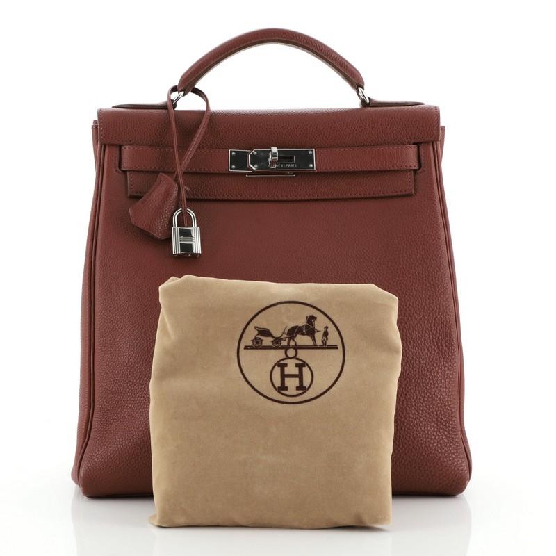 Condition: Very good. Wear on base corners, minor creasing on rear, discoloration and wear on strap. Slight cracking on side opening wax edges, scuffs and wear in interior, scratches on hardware. 
Accessories: Lock, Clochette, Keys, Dust Bag