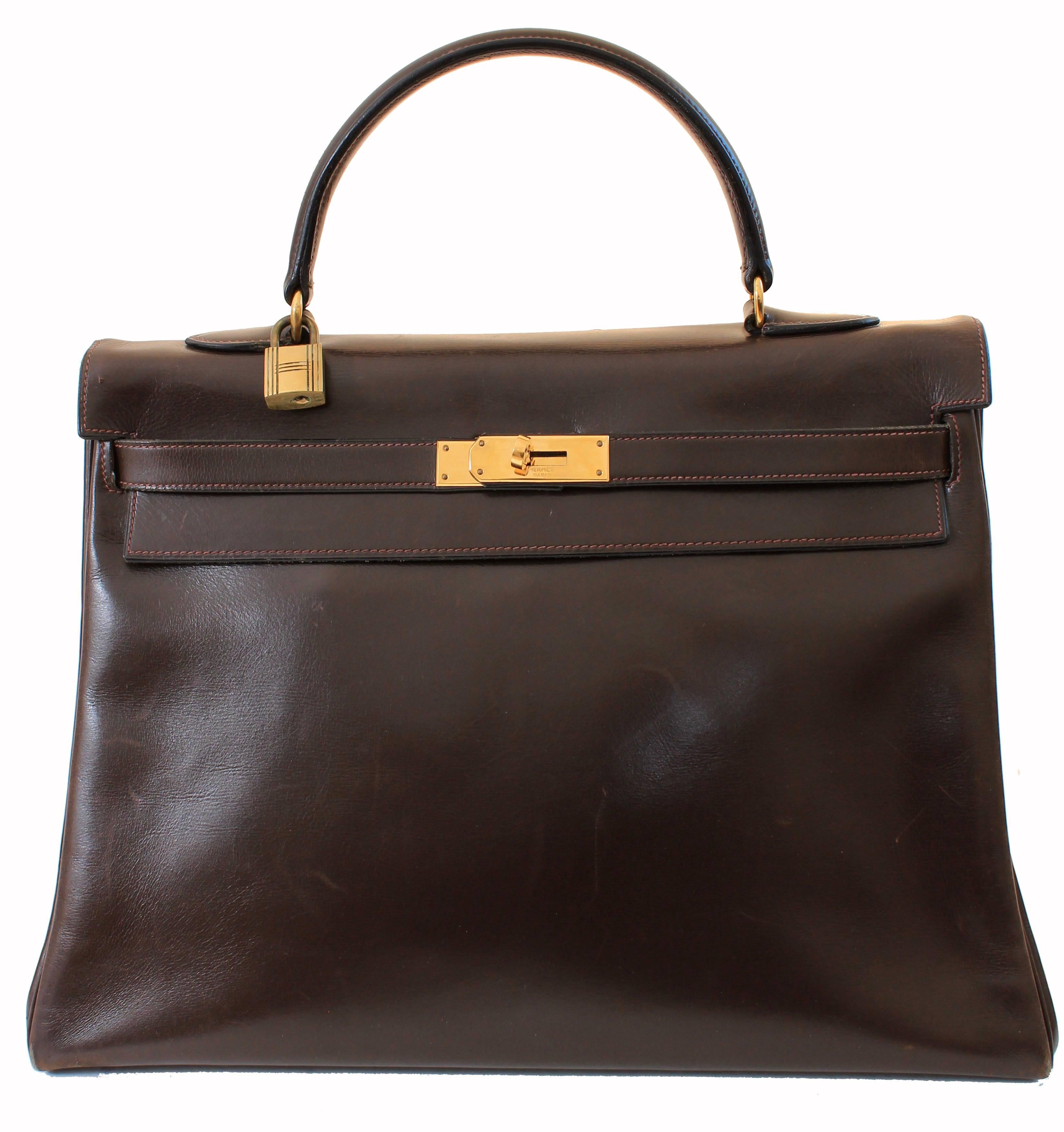 This fabulous handbag was made by Hermes in 1945.  Originally coined the Sac a Depeches - this piece was made about 12 years before Grace Kelly wore the style that we now know as the Kelly bag.  Made from Hermes signature box leather in a deep brown