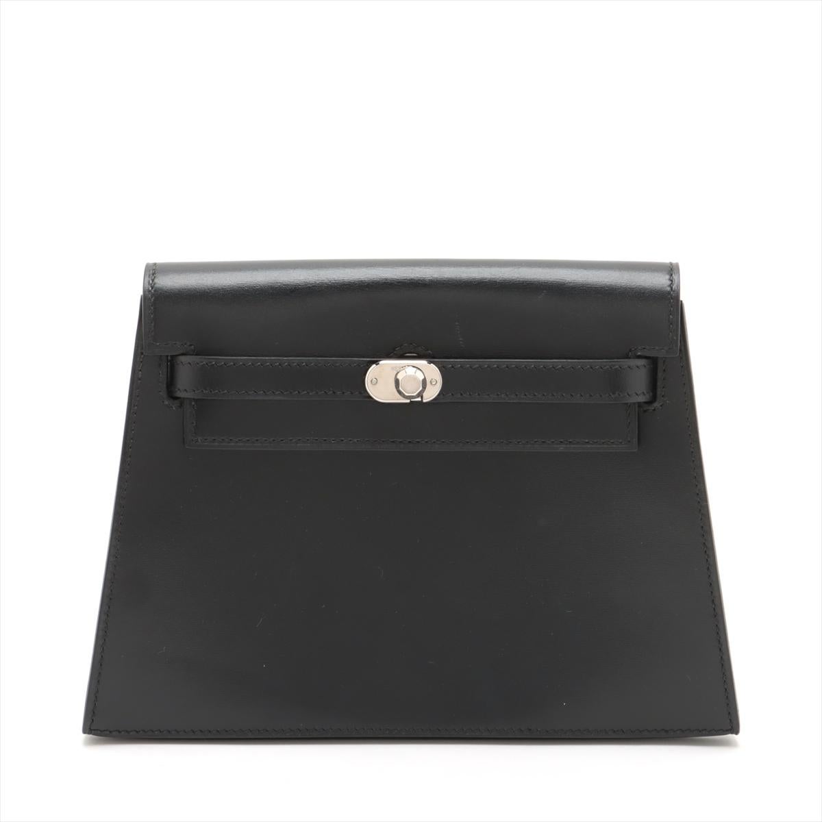 The Hermès Kelly Box Calf Clutch Bag in Black is a timeless and sophisticated piece that embodies Hermès' iconic craftsmanship and elegance. Crafted from luxurious Box Calf leather, known for its smooth and glossy finish, the clutch exudes classic