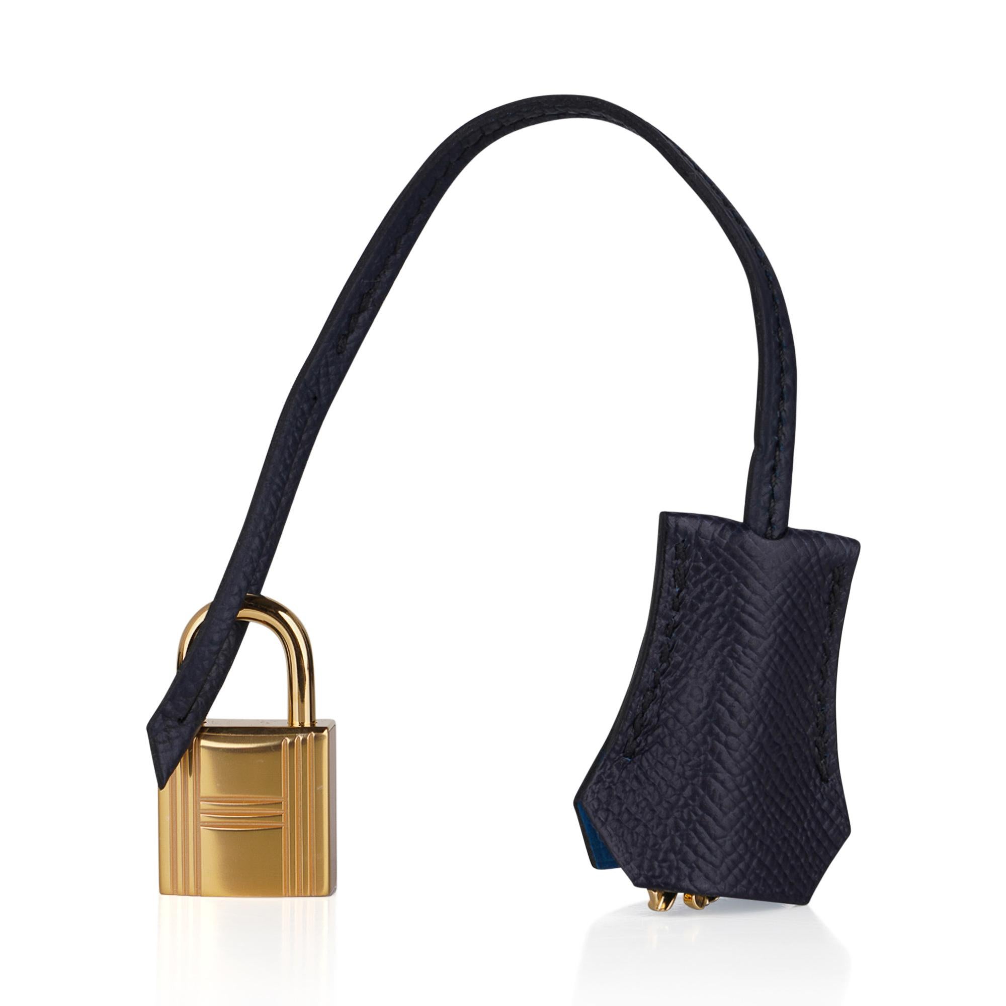 Mightychic offers a guaranteed authentic Hermes Kelly Sellier 28 Casaque tri-colour bag featured in Black and Blue Indigo.
Vivid Bleu Frida interior.
Beautiful and exotic, this epsom leather Hermes Kelly Sellier limited edition bag is perfect for
