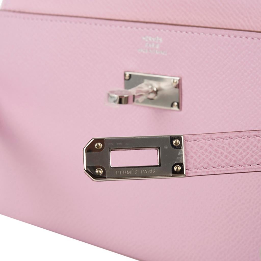 Guaranteed authentic Hermes Kelly Classic Long (Longue) wallet features soft Mauve Sylvestre. 
Often carried as a clutch this Mauve Sylvestre with Jaune De Naples interior Kelly wallet beauty is a jewel in your hand.
Kelly Candena zipper pull.