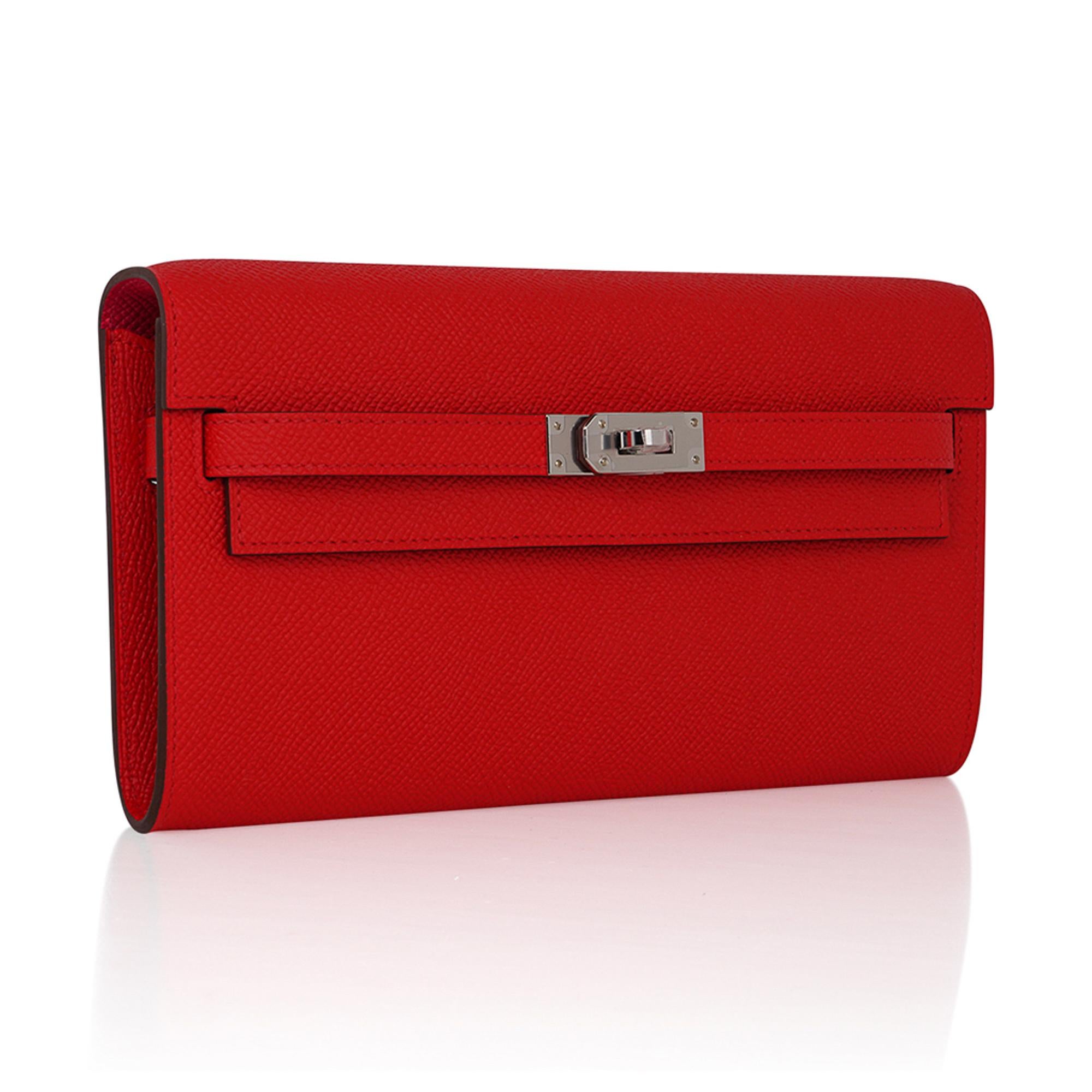 Mightychic offers an Hermes Kelly Classique To Go Verso wallet featured in Rouge de Coeur with Rose Extreme interior.
This beautiful Hermes red is accentuated in Epsom leather.
Often carried as a clutch, this Kelly wallet beauty is a jewel in your