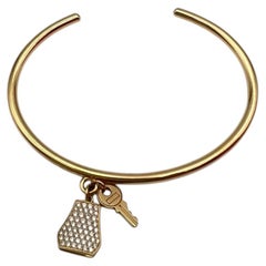 Hermès Kelly Clochette 18k Gold Diamond Charm Open Cuff Bracelet
