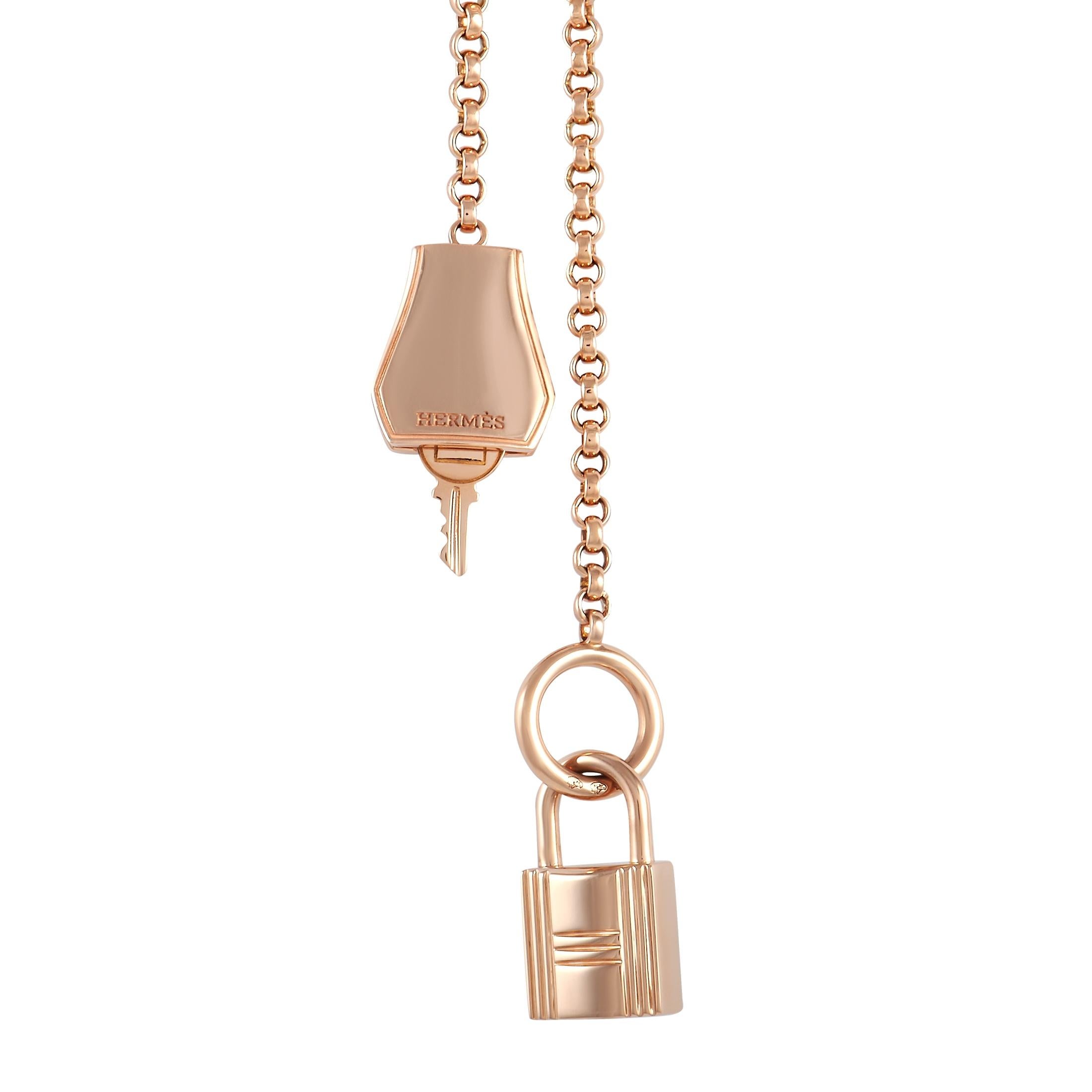 Elevate any jewelry collection with this dramatic Hermes Kelly Clochette Long Necklace. Suspended from a 40” chain made from opulent 18K Rose Gold, you’ll find both a lock and key detail as well as an artistic reinterpretation of the leather key
