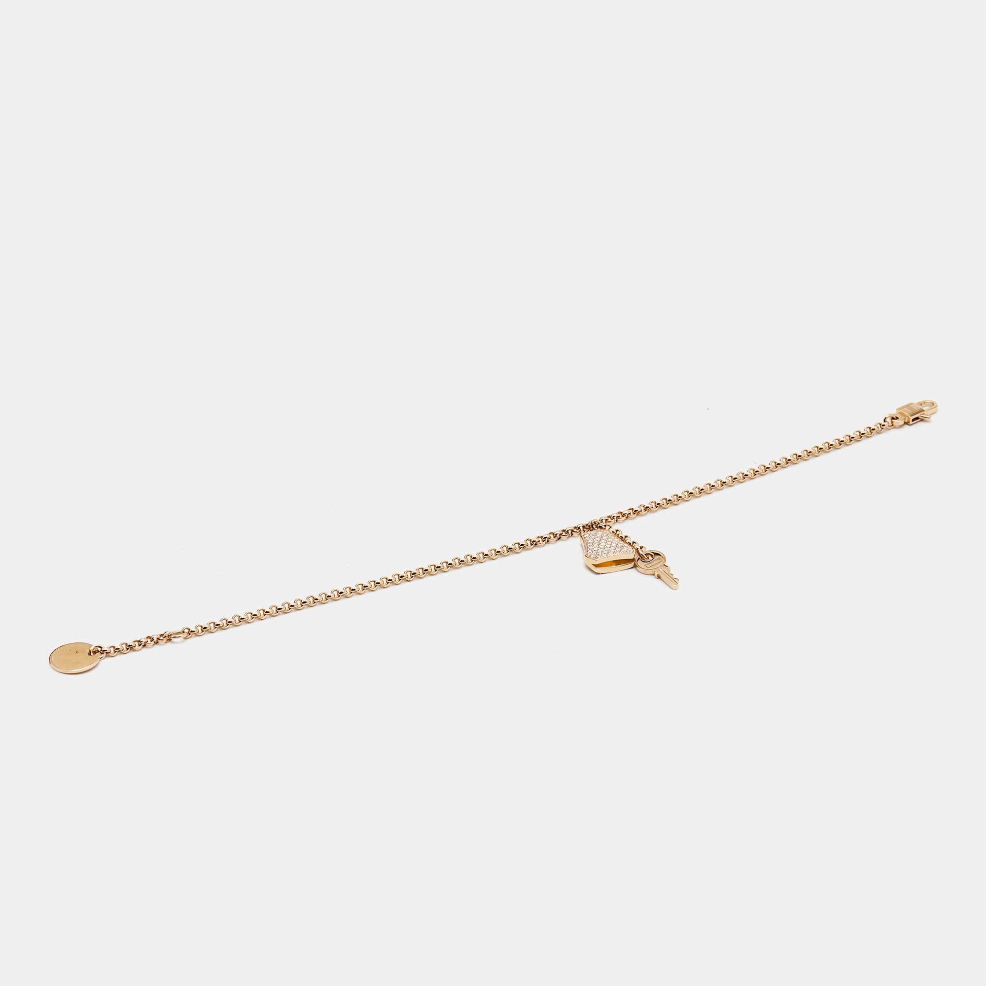 The Hermes bracelet exudes elegance and luxury. Crafted with exquisite precision, this bracelet features a delicate chain in 18k rose gold adorned with shimmering diamonds. Inspired by the iconic Hermes Kelly bag, the clochette charm adds a touch of