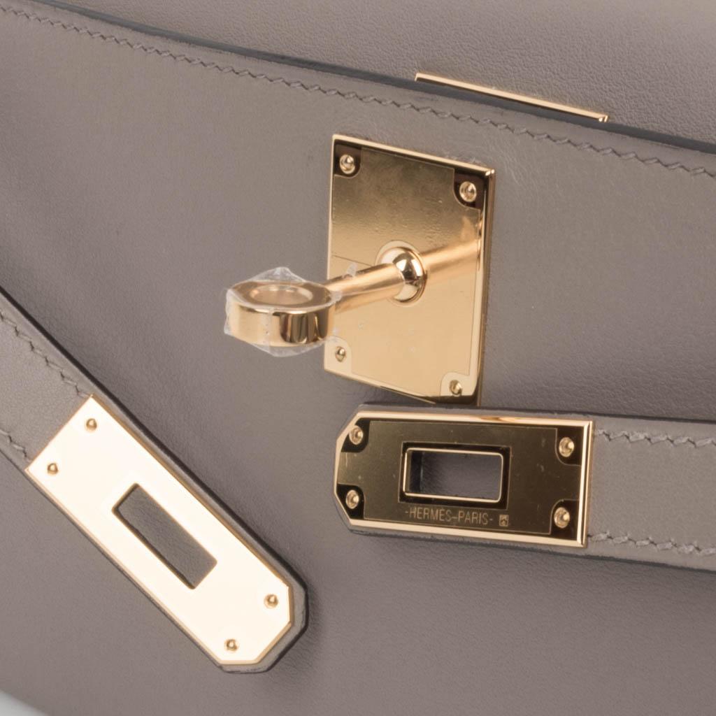 Mightychic offers an Hermes Kelly Cut in the understated elegance of Gris Asphalte - the perfect gray hue.
Rich gold hardware.
Swift leather. 
Comes with box, sleeper and signature Hermes box.  
NEW or NEVER WORN. 
final sale

BAG MEASURES:
LENGTH