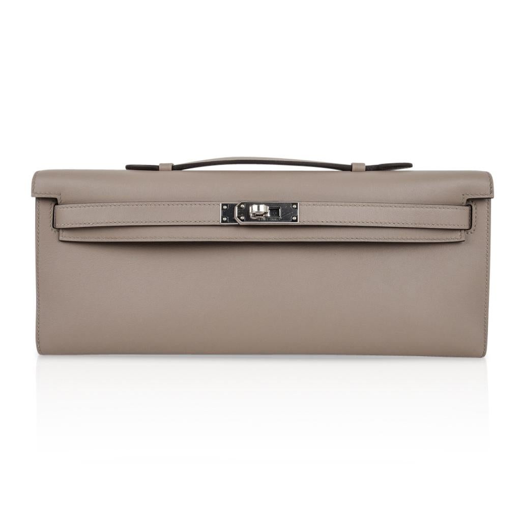 Mightychic offers a guaranteed authentic Hermes Kelly Cut in the understated elegance of Gris Asphalte - the perfect gray hue.
Rich gold hardware.
Swift leather. 
Comes with box, sleeper and signature Hermes box.  
NEW or NEVER WORN. 
final