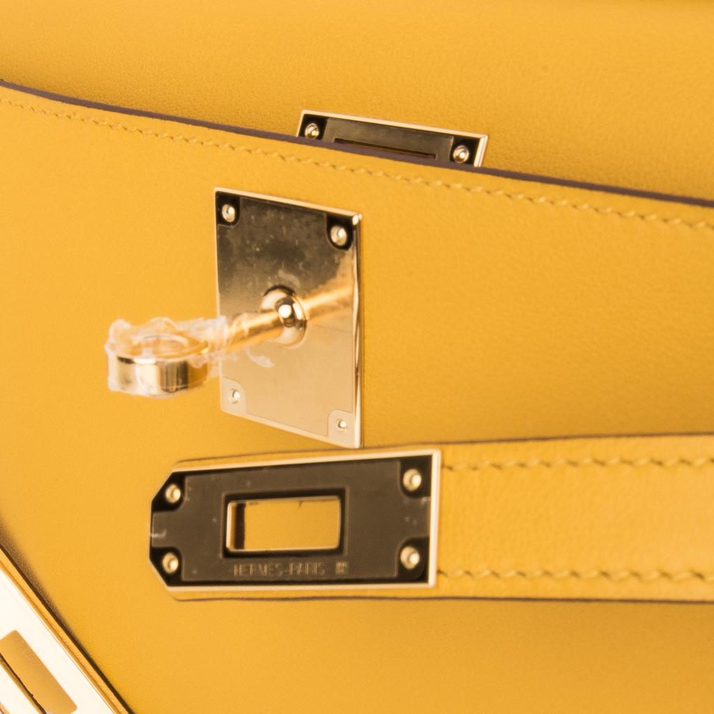 Mightychic offers a timeless Hermes Kelly Cut bag featured in warm Jaune Ambre.
This beautiful Hermes clutch is perfect day to evening for year round wear. 
Swift leather. 
Lush with Gold hardware.  
NEW or NEVER WORN.   
Comes with sleeper and