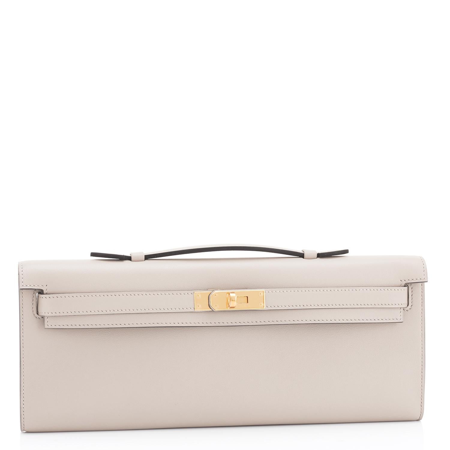 Guaranteed Authentic Hermes Kelly Cut Beton Cream Grey Clutch Swift Gold Hardware Y Stamp, 2020
Brand New in Box. Store fresh. Pristine condition (with plastic on hardware).
Just purchased from Hermes store; bag bears new 2020 interior Y