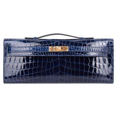 Pochette Kelly de Hermès en cuir de crocodile avec accessoires en or et saphirs bleus:: neuve dans sa boîte