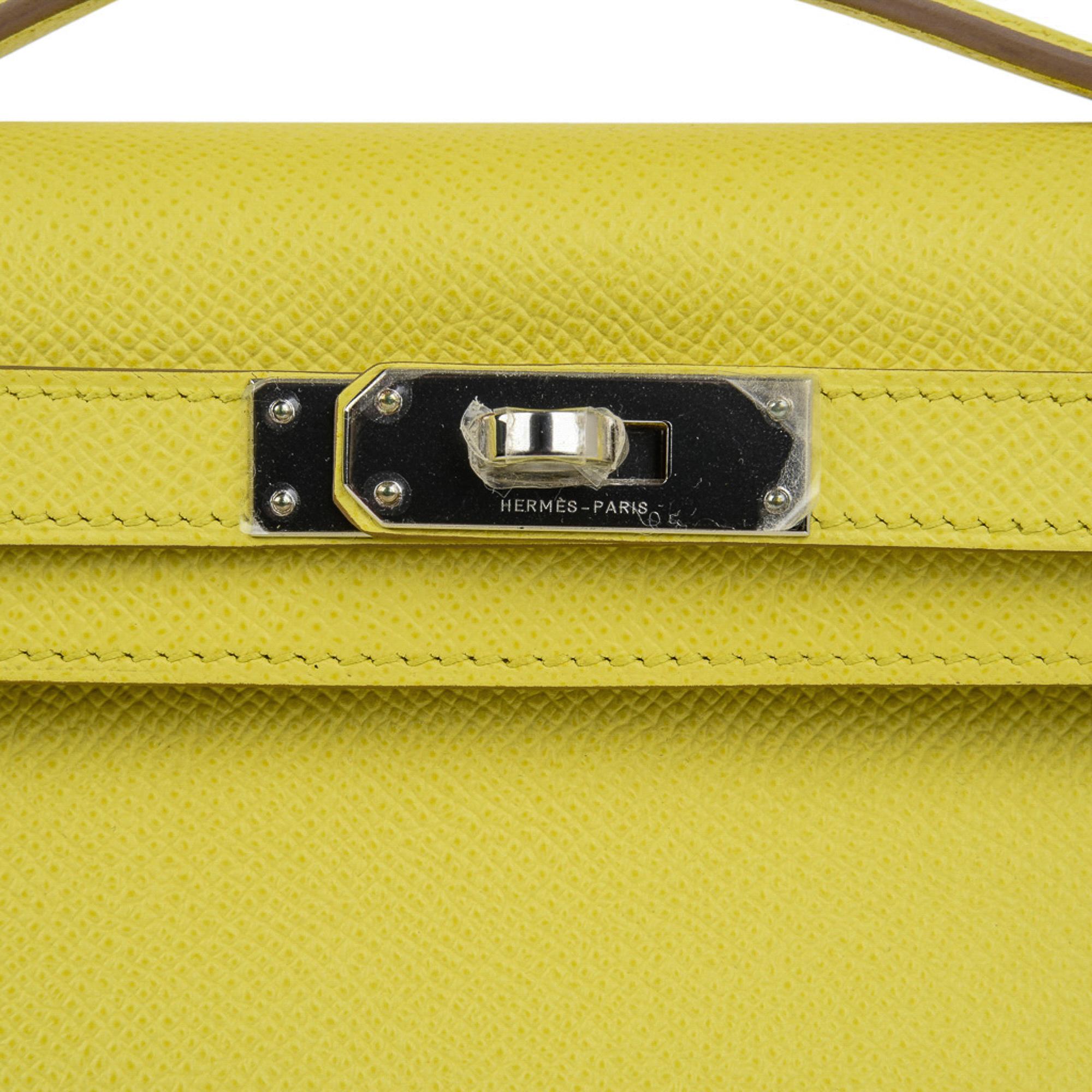 Mightychic offers a guaranteed authentic Hermes Kelly Cut bag feautred in Souffre.
Souffre is a fresh yellow pop of neutral colour and rare to find in Epsom. 
Accentuated with palladium hardware. 
This treasure is easily carried day or night, casual