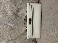 Pochette Hermes Kelly cut craie con hardware palladio