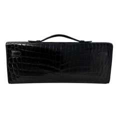 HERMES Kelly Cut "Noir" Schwarz Glänzend Niloticus Krokodil Permabrass Hardware
