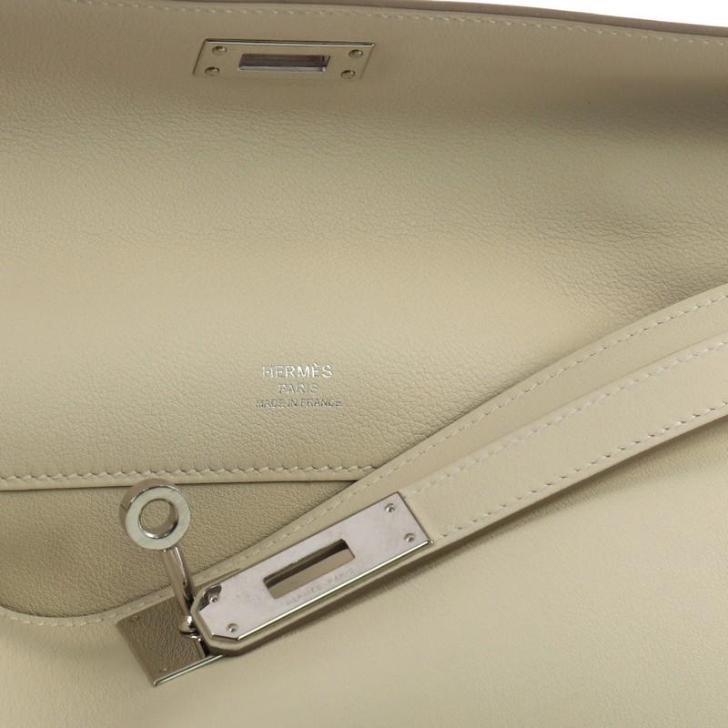 Hermes Kelly Cut Pochette Swift, crafted in Craie cream Swift leather 1