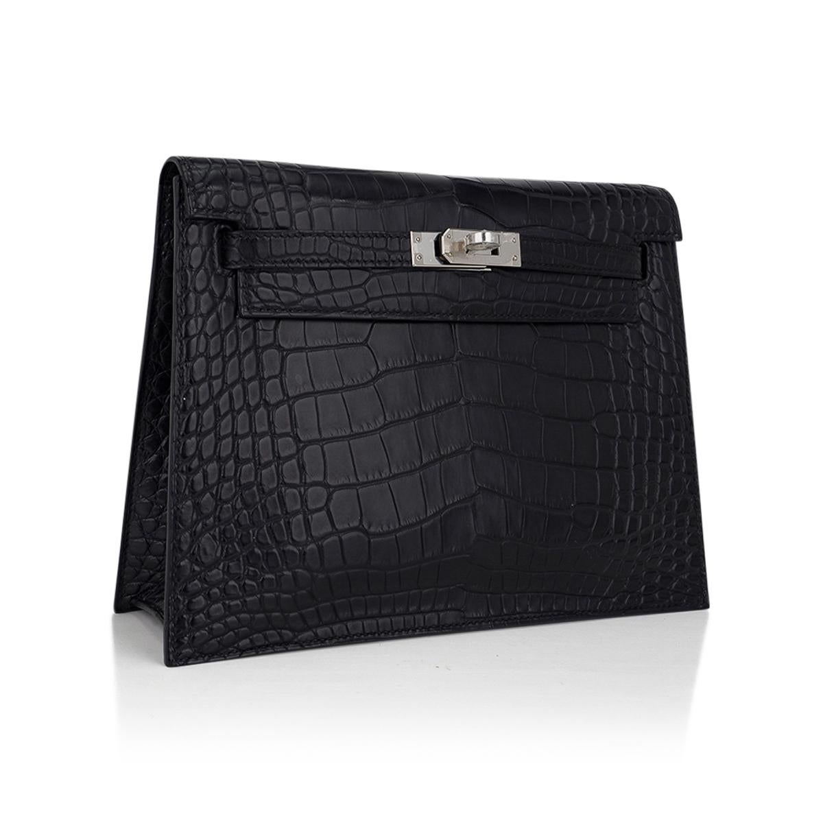 Mightychic offers a Limited Edition Hermes Kelly Danse bag in matte Black Crocodile with crisp palladium hardware.
So rare, many believe it never existed! And even more rare in Crocodile!
This Kelly Danse is the most versatile bag created by the