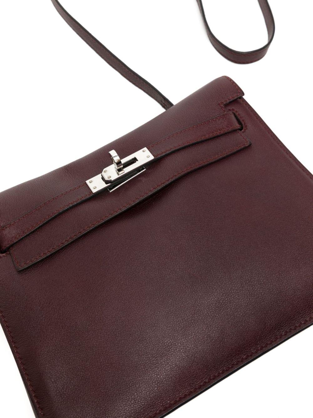 Jean-Paul Gaultier designed the Hermès Kelly Danse 2008, an iteration of the Maison's classic, taking a practical belt bag form. This specific example from 2010 is crafted from Evercolour leather in deep burgundy, complemented by polished