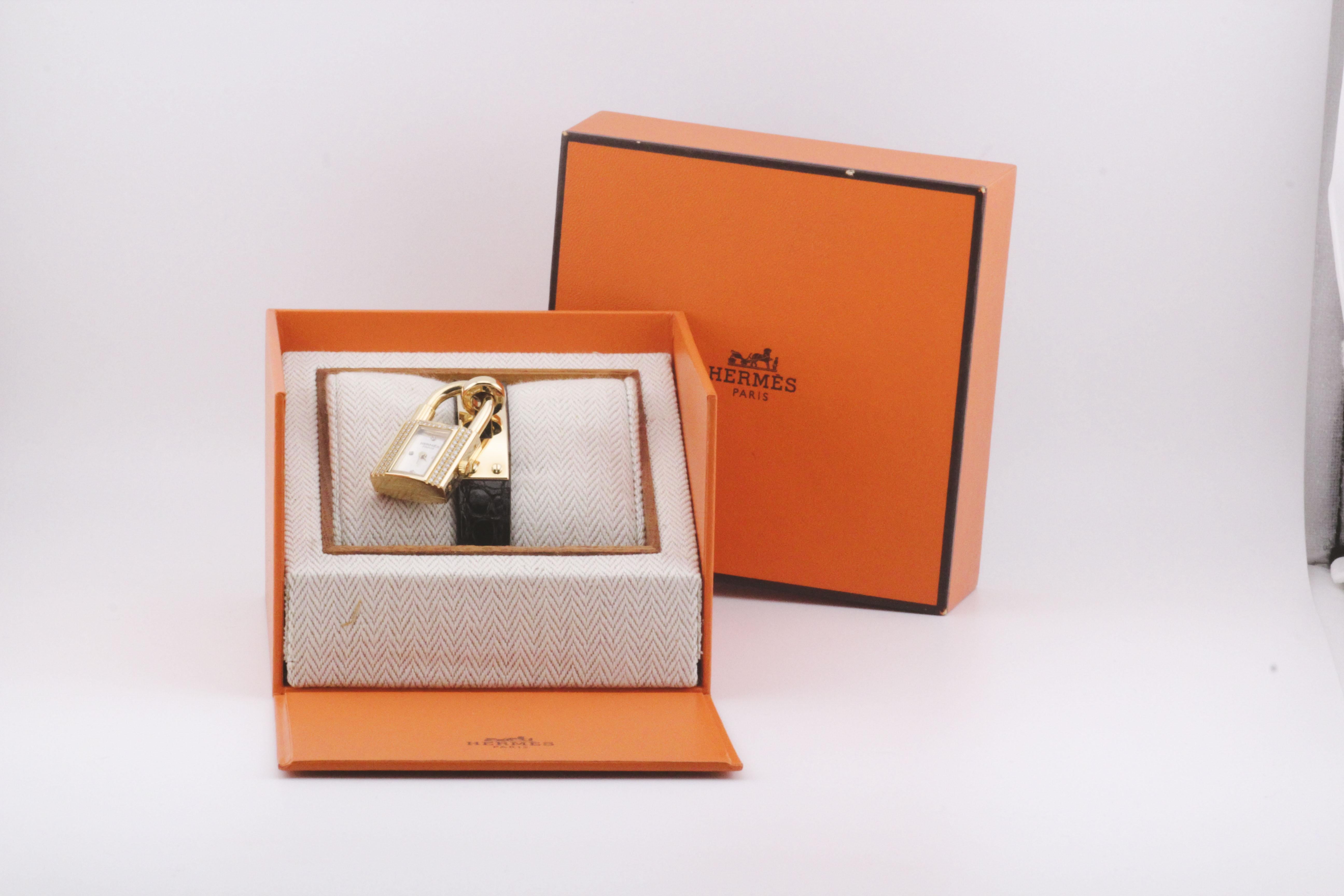 The Hermès Kelly Watch in 18K Yellow Gold with Diamond Accents and a leather strap is a testament to Hermès' dedication to luxury and precision. This exquisite timepiece combines the richness of yellow gold with the brilliance of diamonds, creating