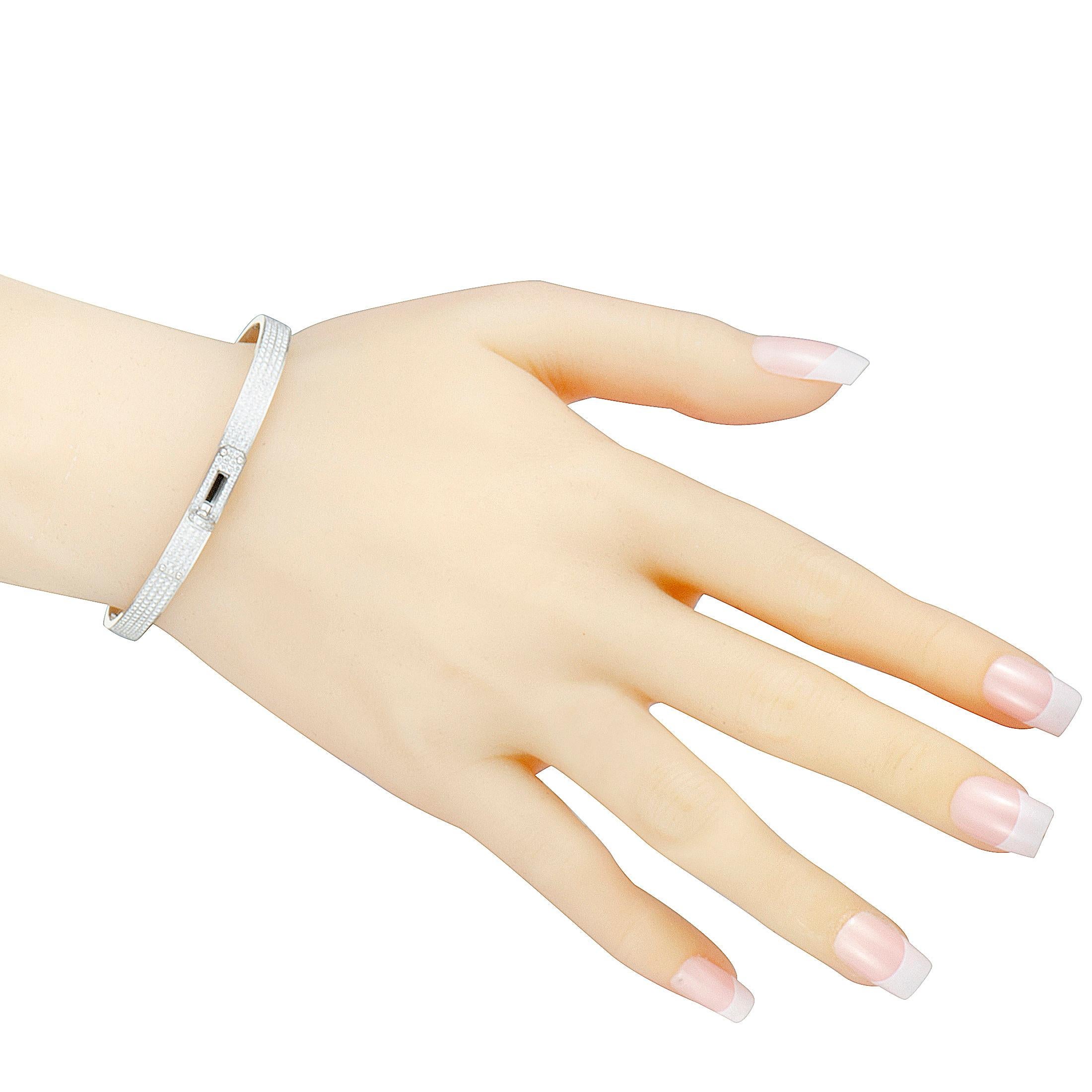 This spectacular bracelet by Hermes from its beautiful Kelly collection is an exemplary illustration of grace and class! The glamorous bracelet is perfectly designed in prestigious 18K white gold and set with 3.40ct of scintillating diamonds that