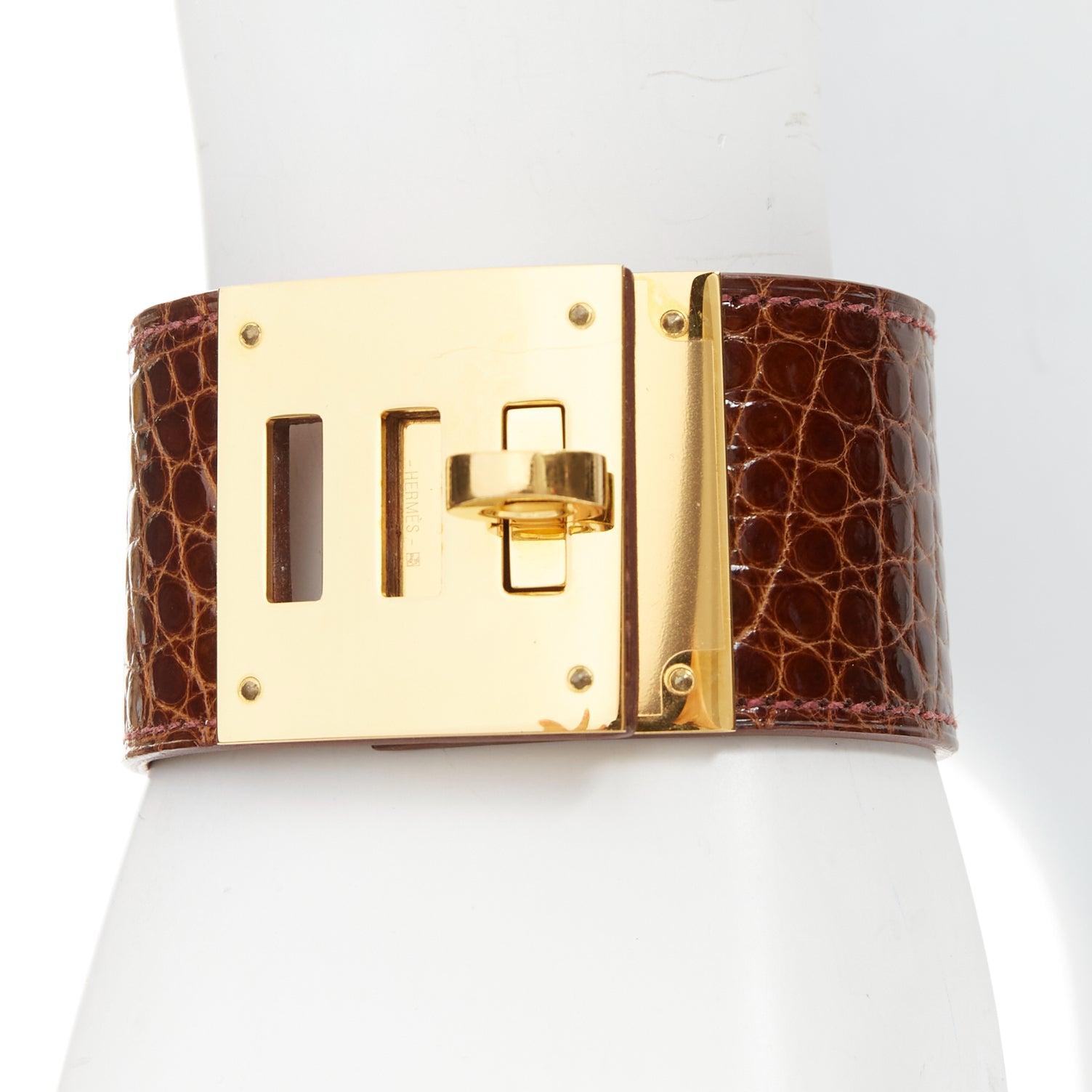 HERMES Kelly Dog brown polished gator leather GHW turnlock bracelet
Reference: TGAS/E00842
Brand: Hermes
Model: Kelly Dog
Material: Leather, Metal
Color: Brown, Gold
Pattern: Animal Print
Closure: Turnlock
Lining: Brown Leather
Extra Details: The