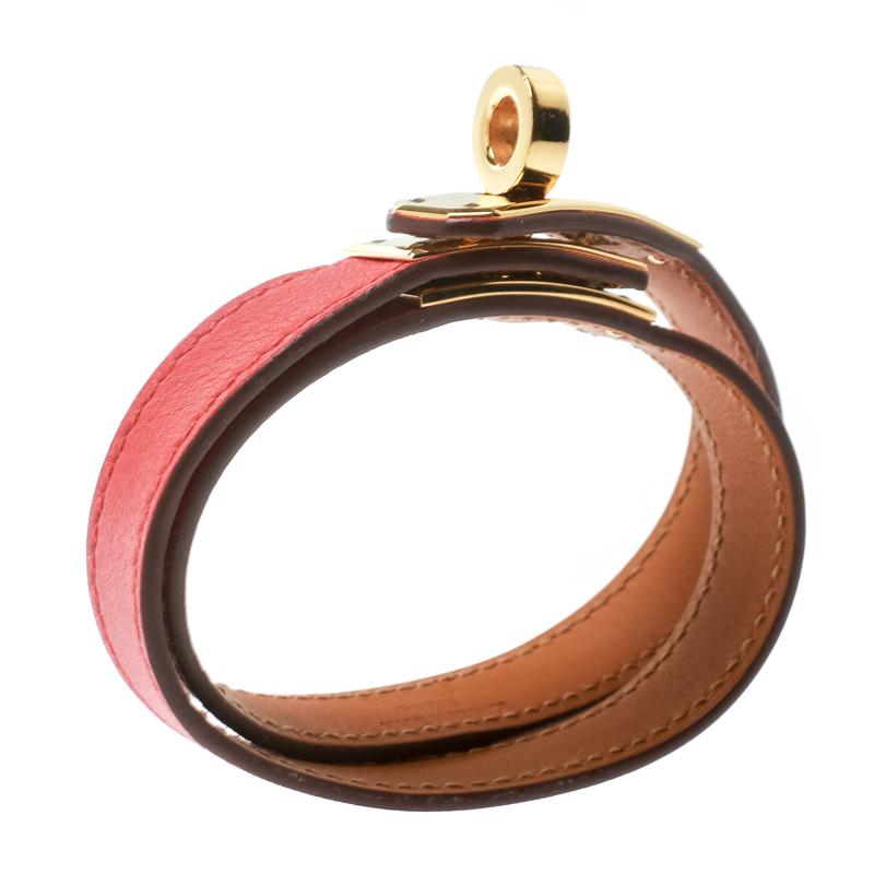 This Hermes Double Tour wrap bracelet is a chic accessory that can be paired with everything, from causals to evening outfits. Made from leather in a lovely orange shade, it is beautified with a Kelly twist closure in gold-plated metal. The bracelet