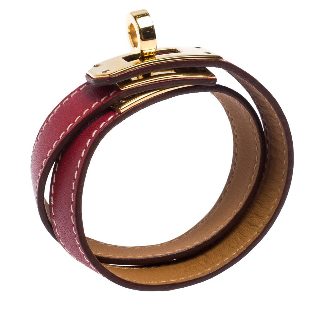 This Hermes Double Tour wrap bracelet is a chic accessory that can be paired with everything, from causals to evening outfits. Crafted from leather in a classic red shade, it is beautified with a Kelly twist closure in gold-plated metal. The