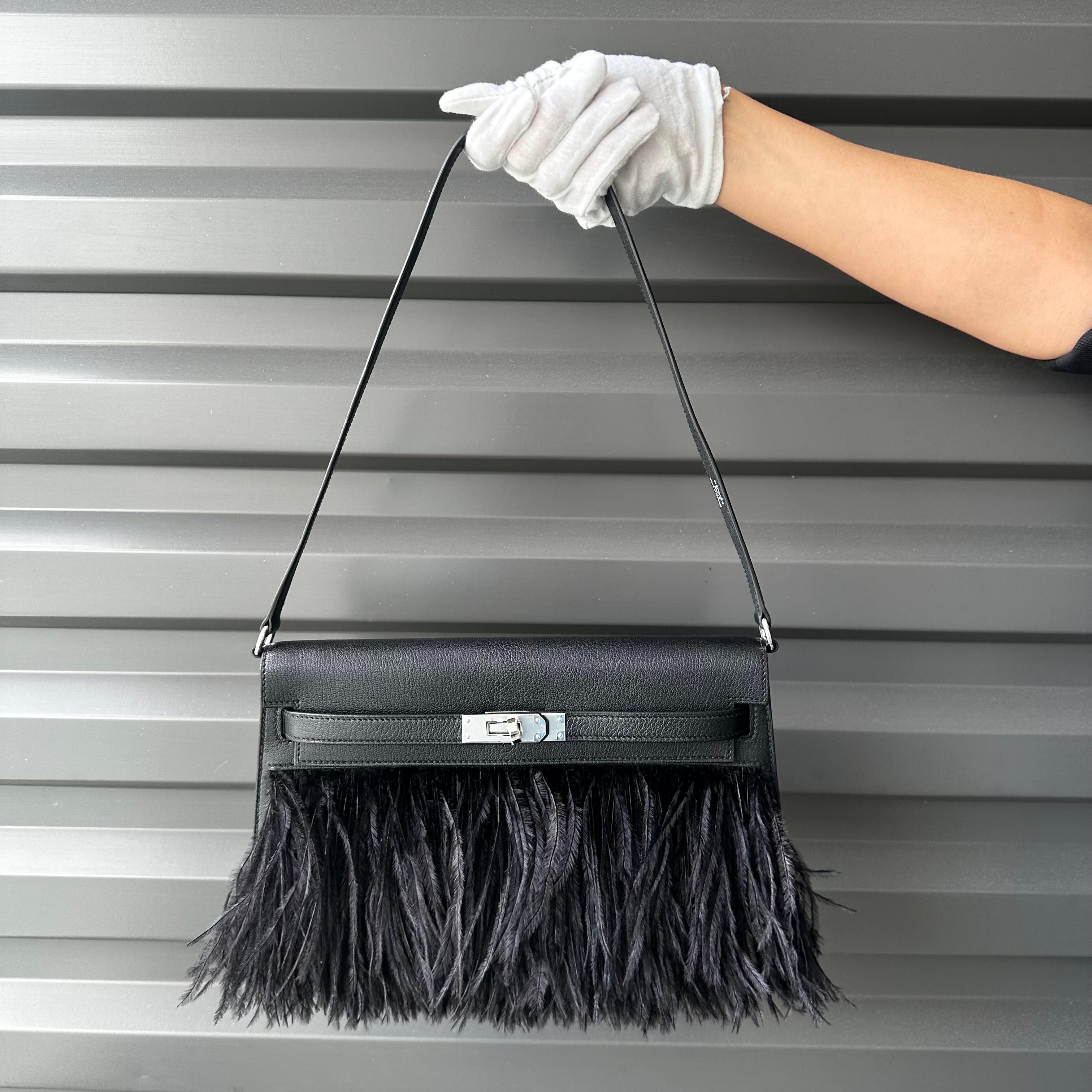 Description: This is a beautiful Brand New Hermes Kelly Elan Folie Black Ostrich Feather Chevre Leather Bag with Palladium Hardware. This stunning bag was seen on the 2023 Hermes Runway and is a reissue of the discontinued Kelly Elan. The bag is
