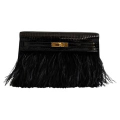 Hermès Kelly Elan Folie Clutch Black Porosus Crocodile
Feather Noir with Gold Hermès Kelly Elan Folie Clutch Black Porosus Crocodile
Feather Noir with Gold