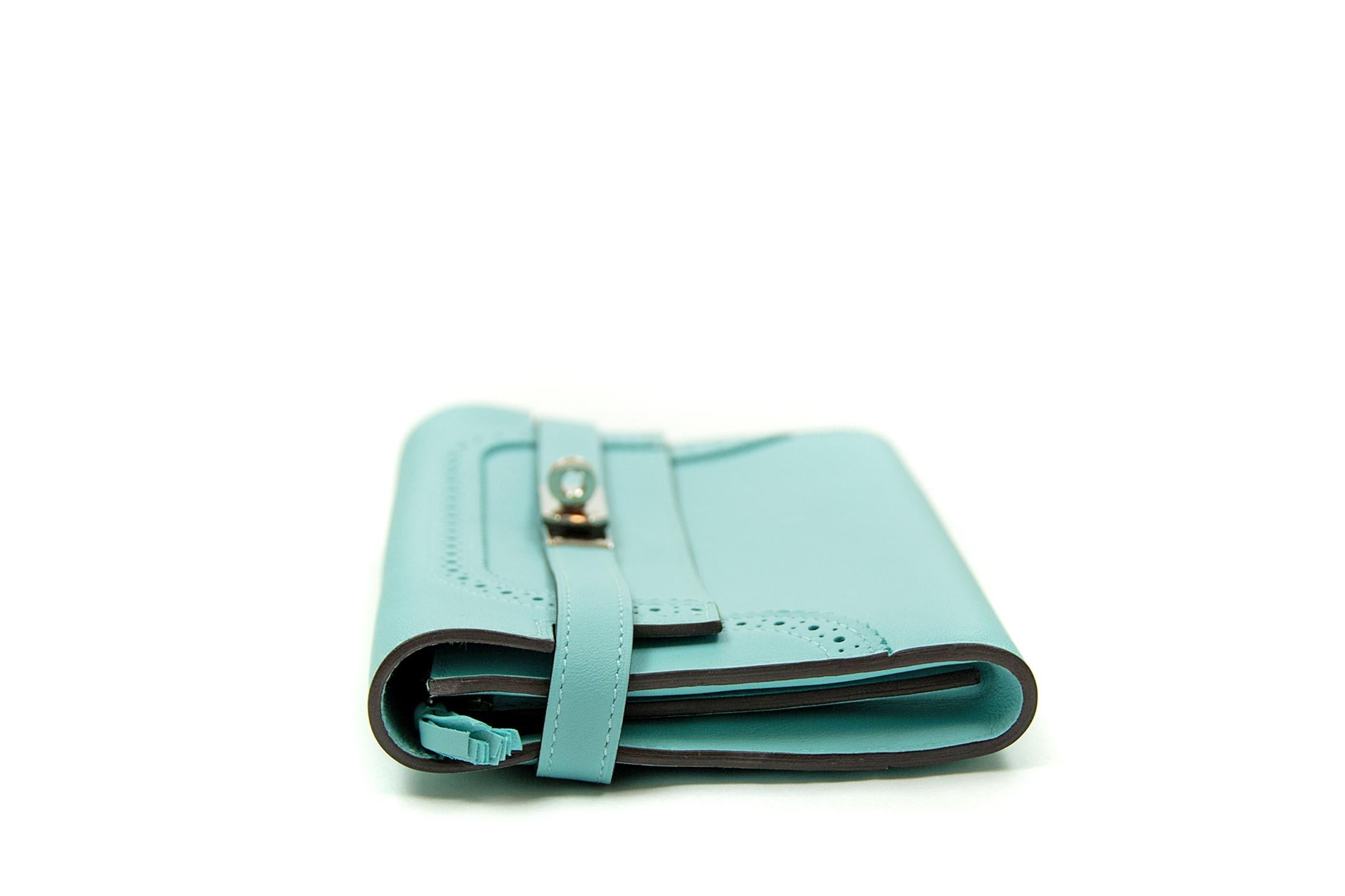 Hermes Kelly Ghillies Wallet in Veau Swift Blue Atoll. This iconic special order Hermes wallet is timeless and chic. Fresh and crisp with palladium hardware. 

    Condition: New or Never Used
    Made in France
    Comes with Signature Hermes Box

