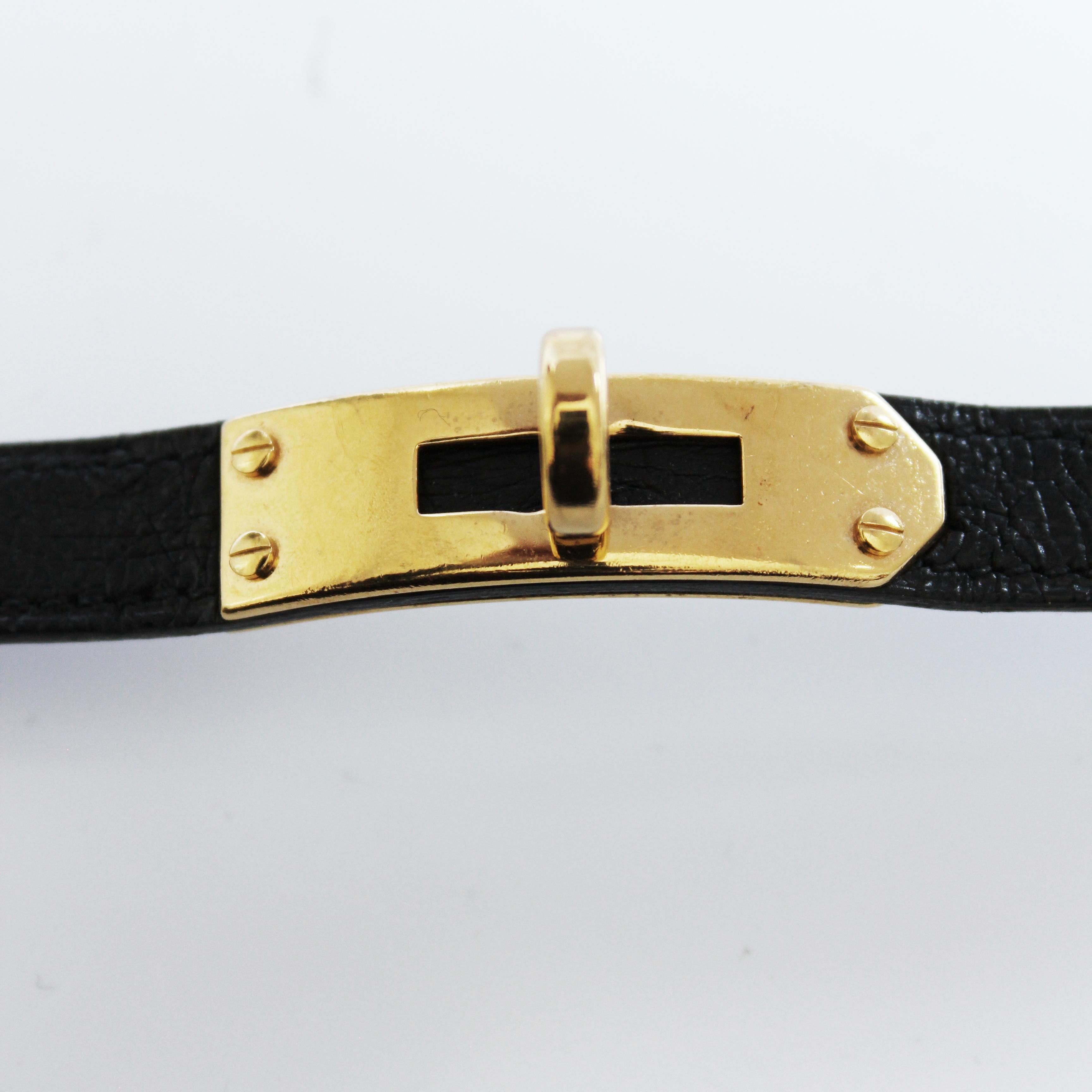 Montre Hermes Kelly Cadena Lock en or avec bracelet en cuir Mysore Chèvre noir 1990 en vente 11