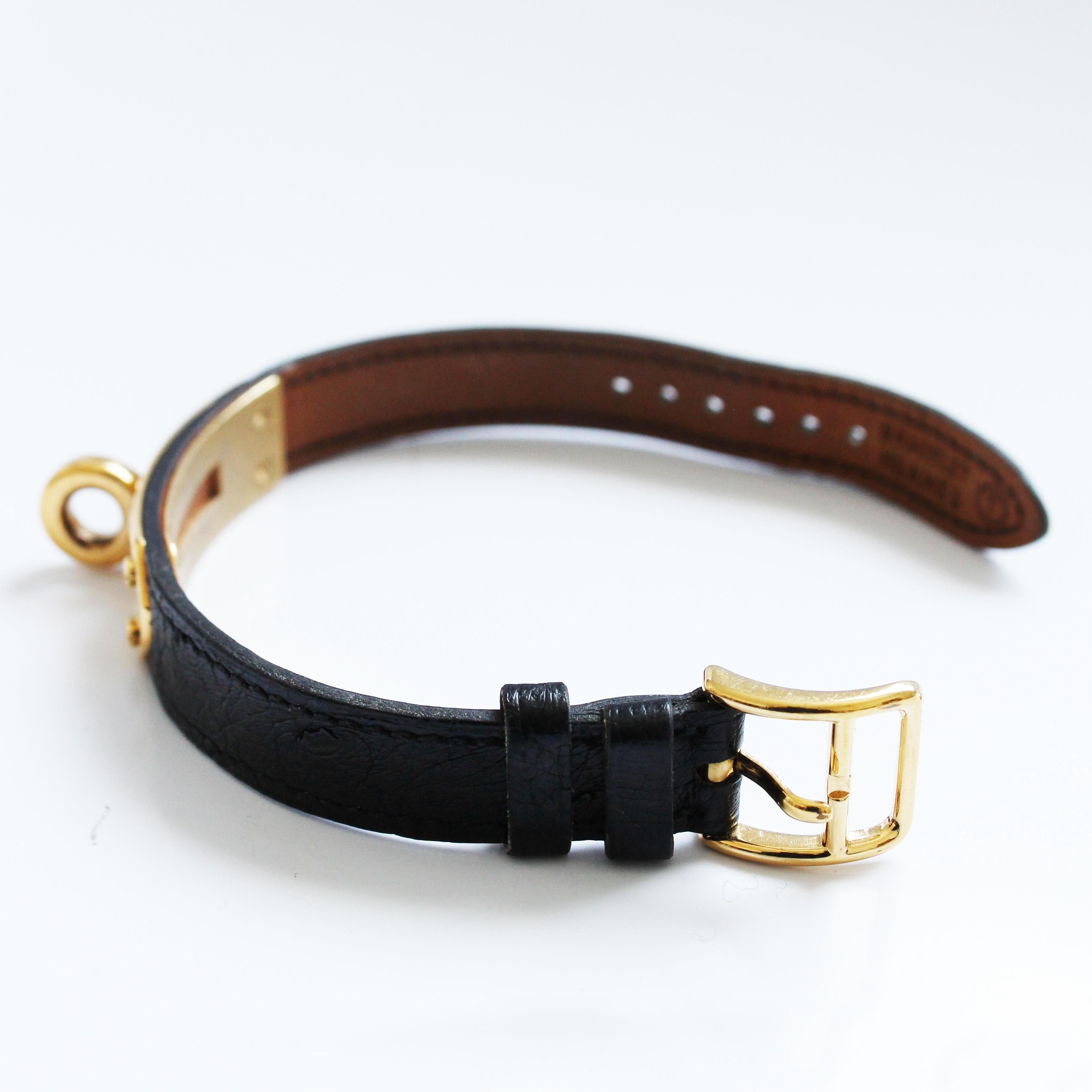 Montre Hermes Kelly Cadena Lock en or avec bracelet en cuir Mysore Chèvre noir 1990 Pour femmes en vente