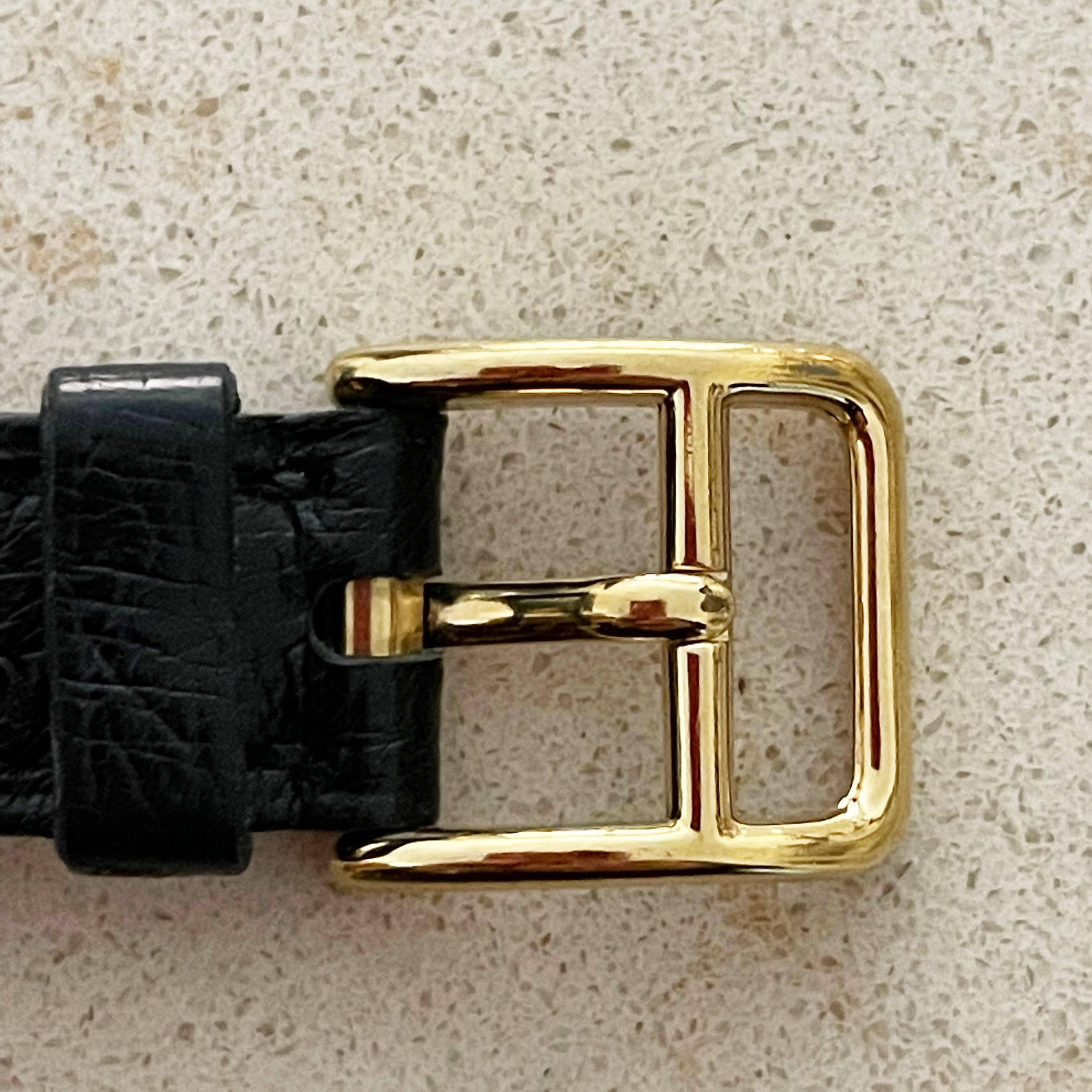 Montre Hermes Kelly Cadena Lock en or avec bracelet en cuir Mysore Chèvre noir 1990 en vente 8