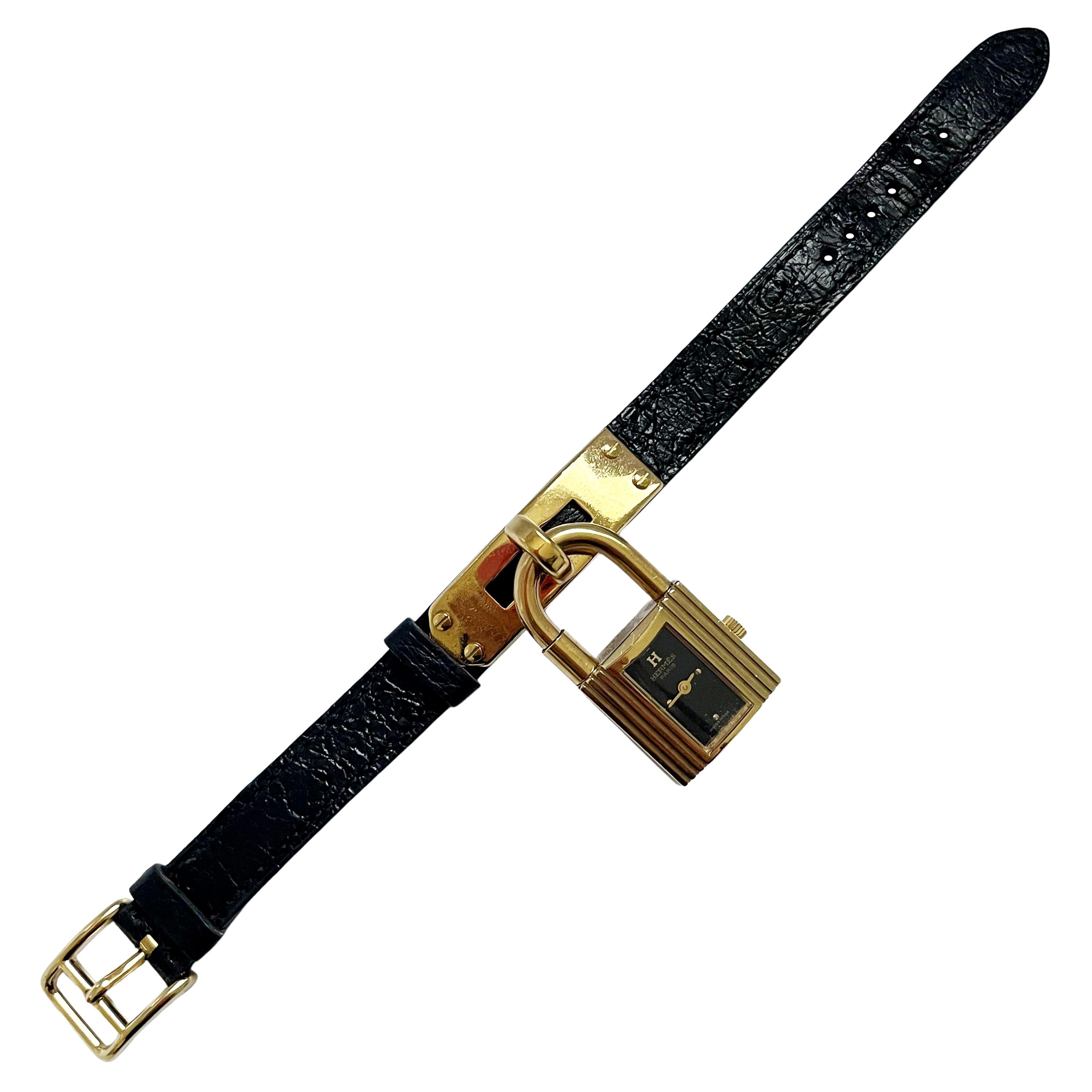 Montre Hermes Kelly Cadena Lock en or avec bracelet en cuir Mysore Chèvre noir 1990 en vente