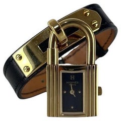 Orologio Hermès Kelly placcato oro con cinturino in pelle nera