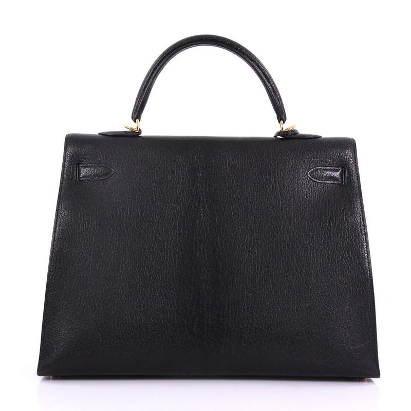 Women's or Men's Hermes Kelly Handbag Black Chevre de Coromandel with Gold Hardware 35