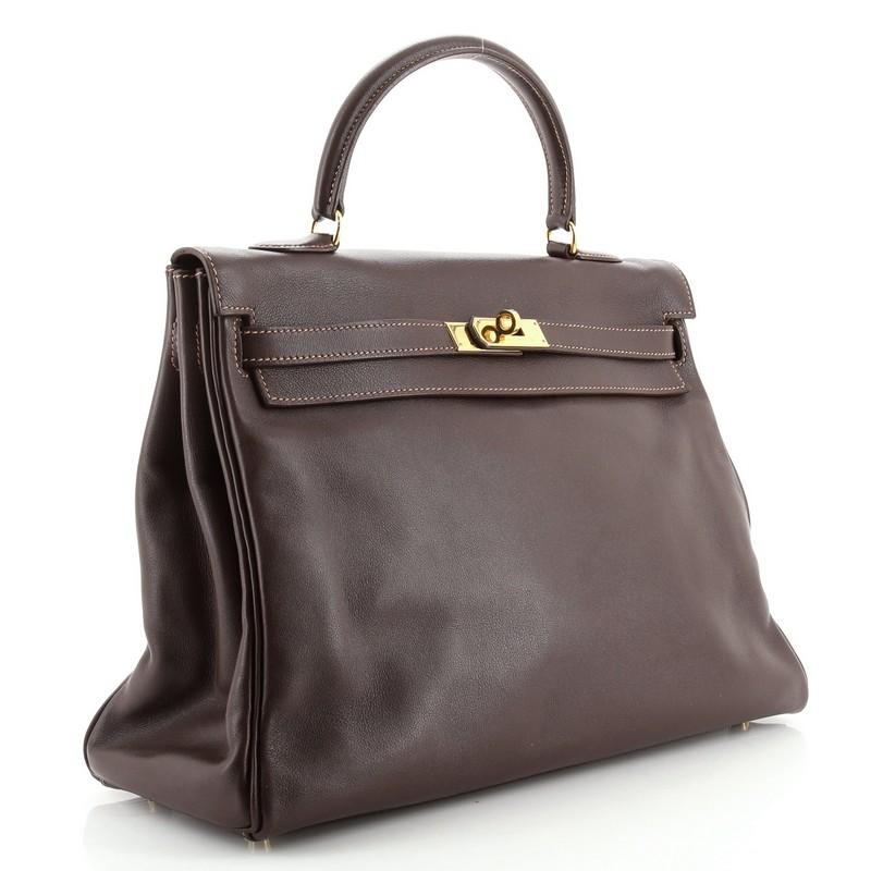 Condition: Damaged. Heavy loss of shape on exterior. Moderate wear, scuffs and indentations on exterior and in interior, wear on handle and strap. Cracking and splitting on flap, closure strap and handle wax edges, scratches and tarnish on