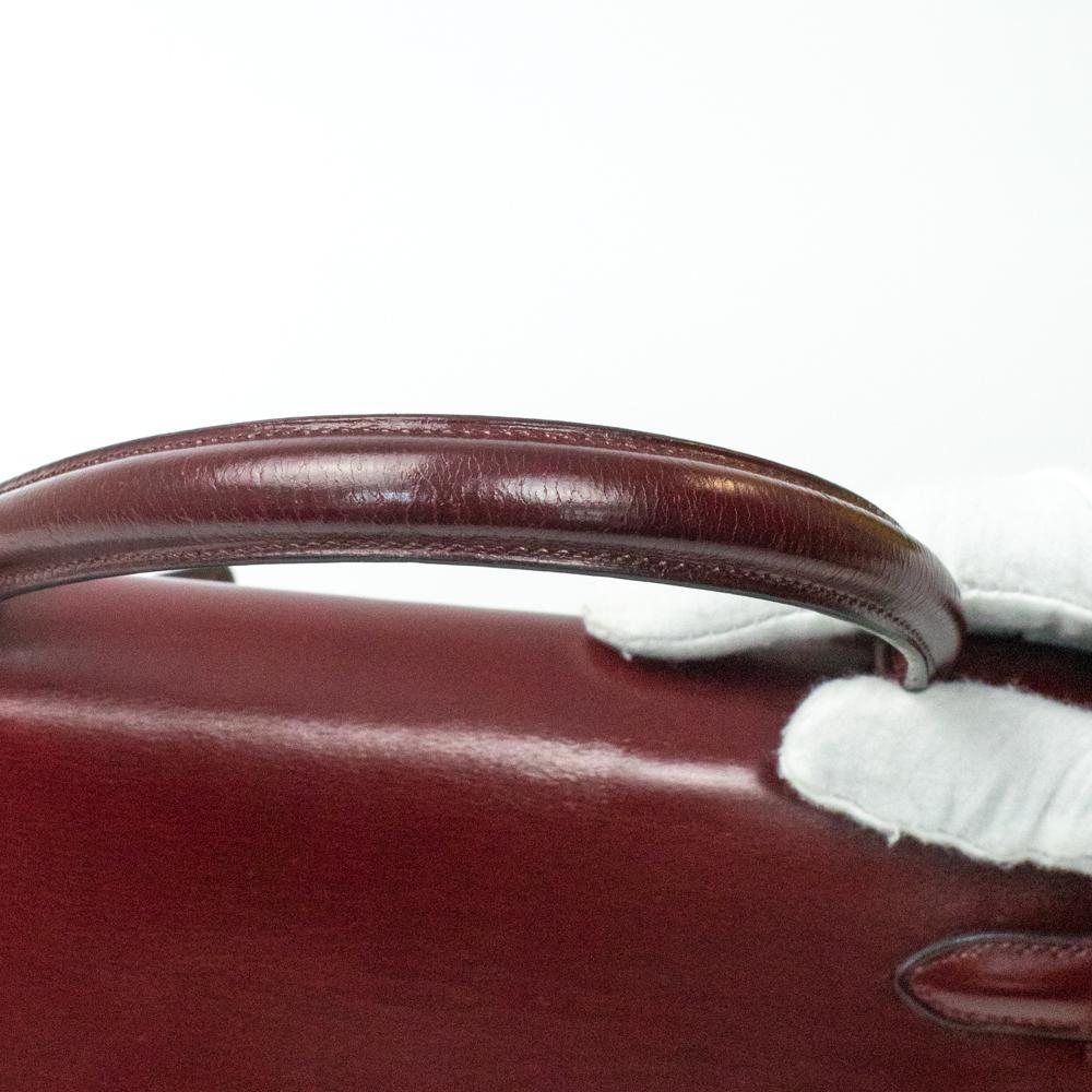 HERMÈS Kelly Handbag in Burgundy Leather 6