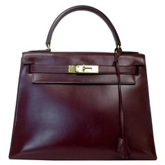 HERMÈS, Kelly Handbag in Burgundy Leather