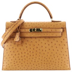 A 35CM COGNAC OSTRICH SELLIER KELLY BAG, HERMÈS, 1996