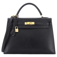 Hermès Kelly Handtasche Noir Ardennes mit goldenen Beschlägen 32