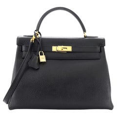 Hermès Kelly Handtasche Noir Ardennes mit goldenen Beschlägen 32