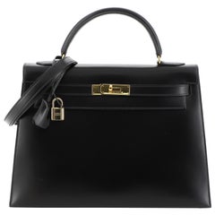 Sac à main Hermès Kelly en cuir de veau avec finitions dorées, taille 32