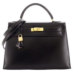 Hermès Kelly Handtasche Noir Box Kalbsleder mit Goldbeschlägen 32