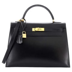 Hermès Kelly Handtasche Noir Box Kalbsleder mit Goldbeschlägen 32